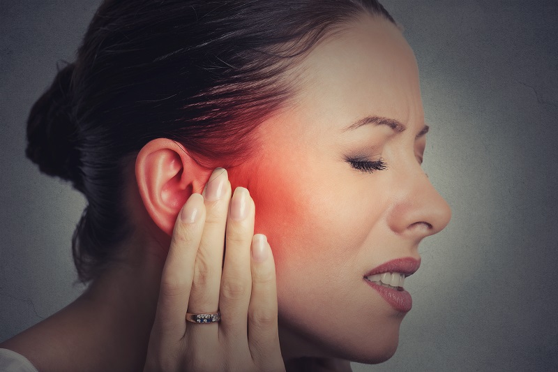 Woman before TMJ treatment at Orange Center for Cosmetic Dentistry 