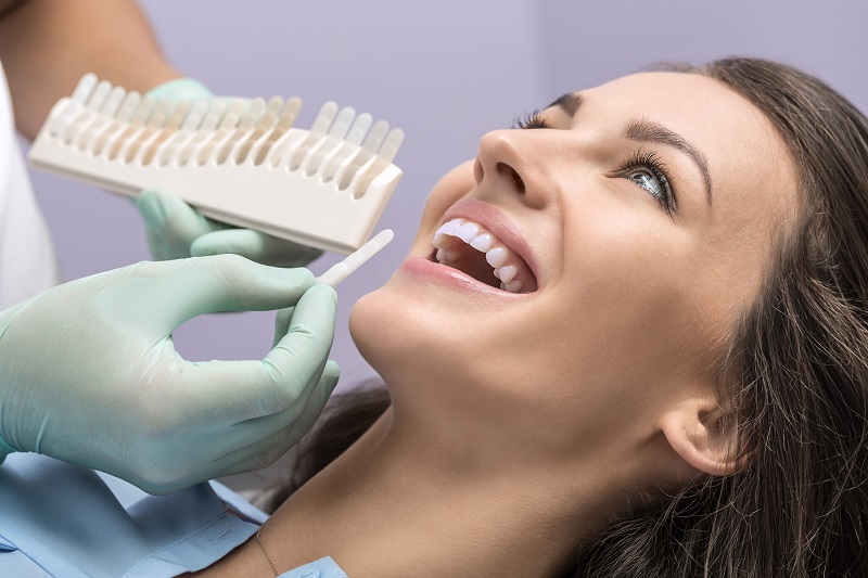 Woman receiving cosmetic dentistry treatments at Orange Center for Cosmetic Dentistry