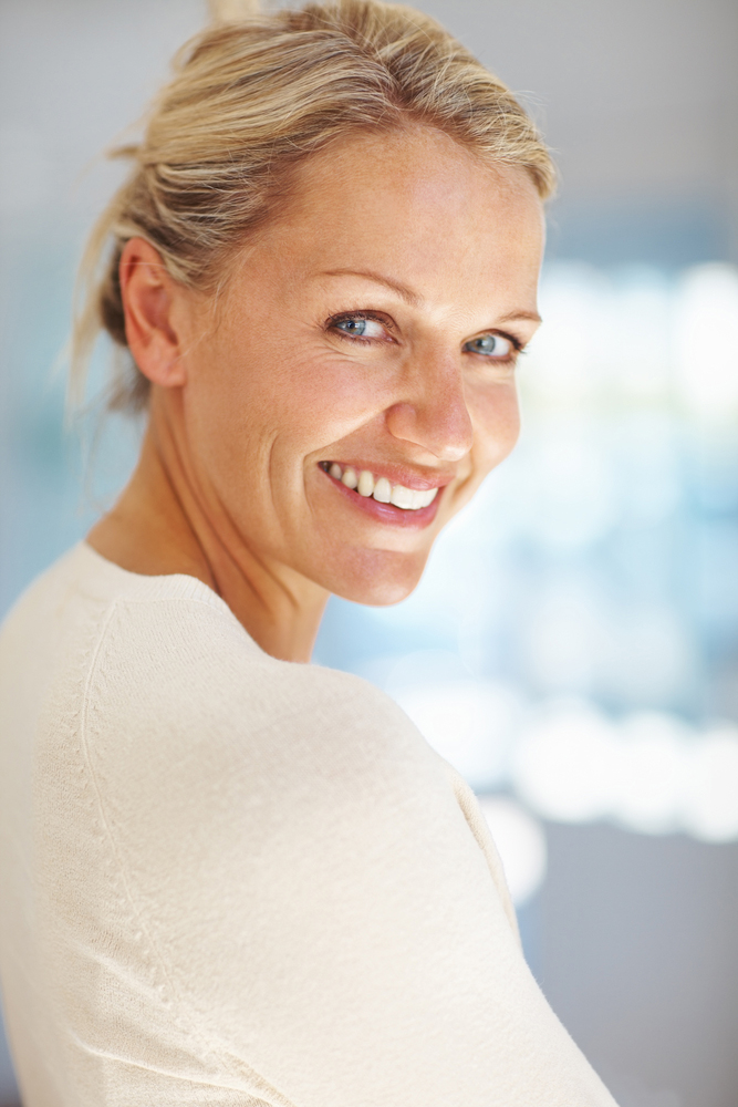 Woman after dental implants from Orange Center for Cosmetic Dentistry